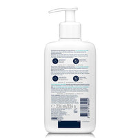 White bottle with pump and label on a white background