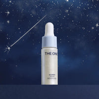 Skincare bottle labeled 'The One' against a starry night sky background