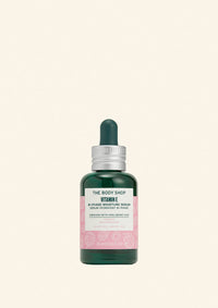 The Body Shop Vitamin E serum bottle on a light green background