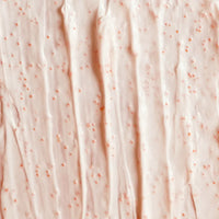 Close-up of pink textured fabric with small specks